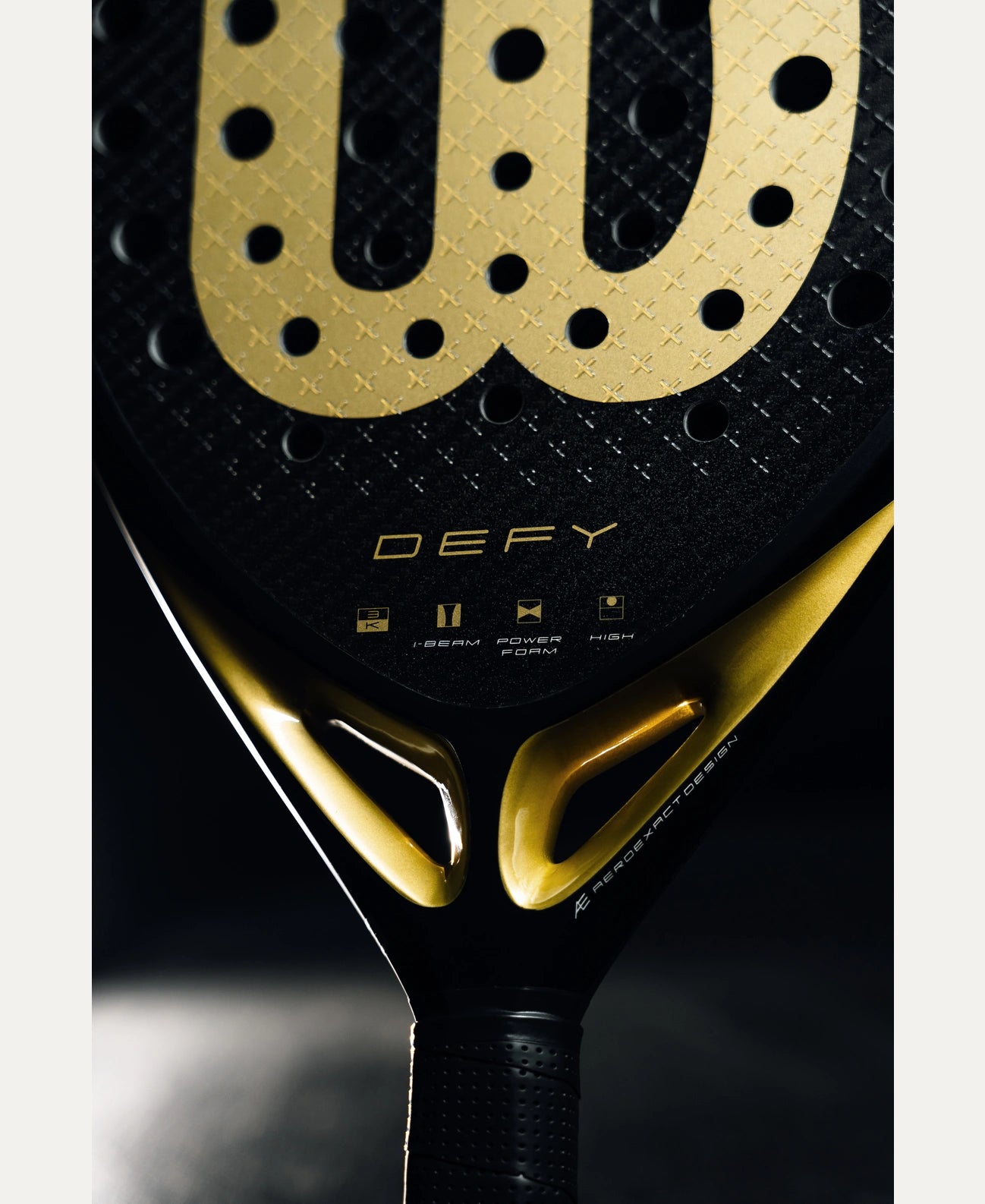 Wilson Defy V1 padel racket — diamond-shape. 3K carbon face, Power Foam core, balanced power. Intermediate to advanced