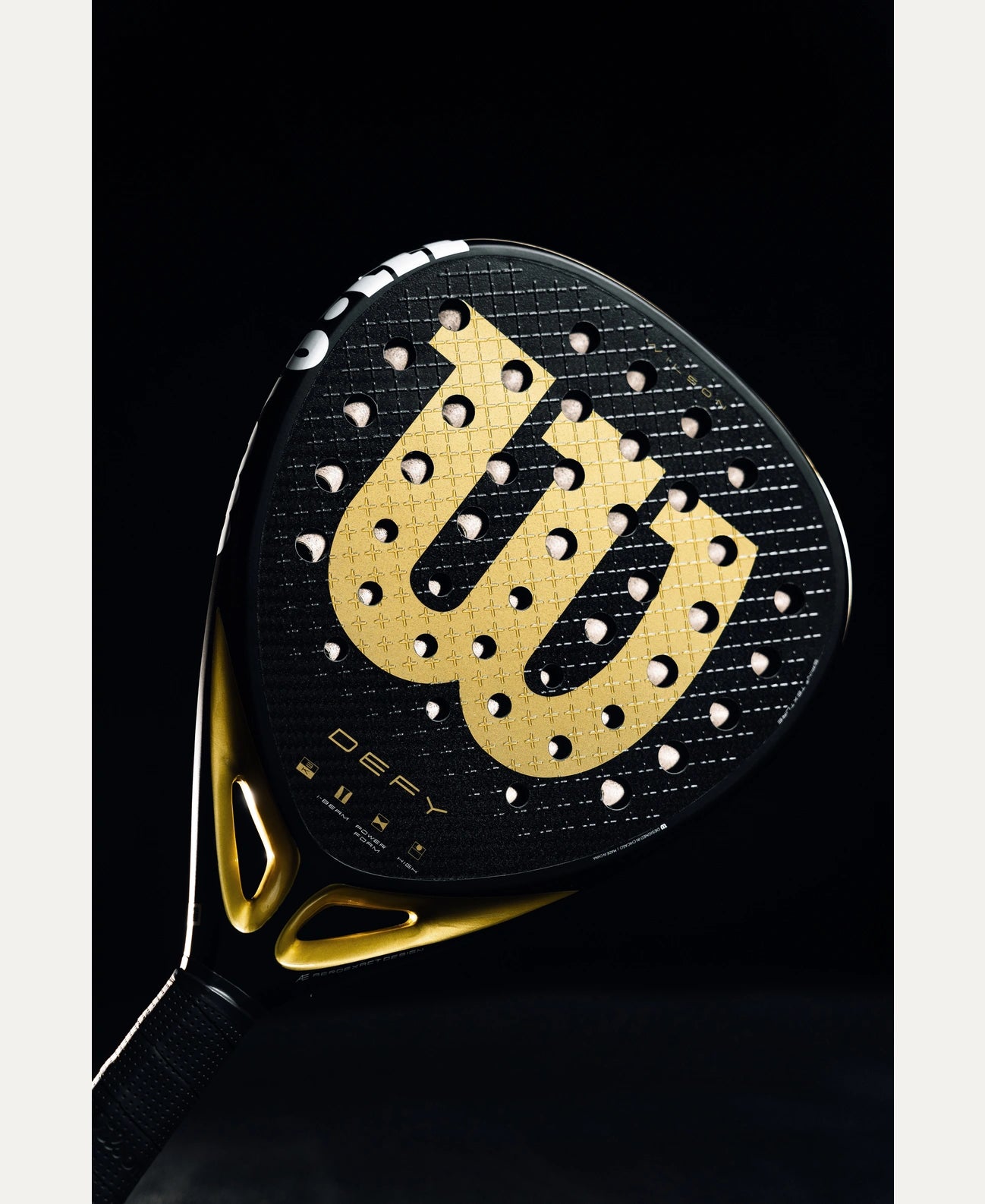 Wilson Defy V1 padel racket — diamond-shape. 3K carbon face, Power Foam core, balanced power. Intermediate to advanced