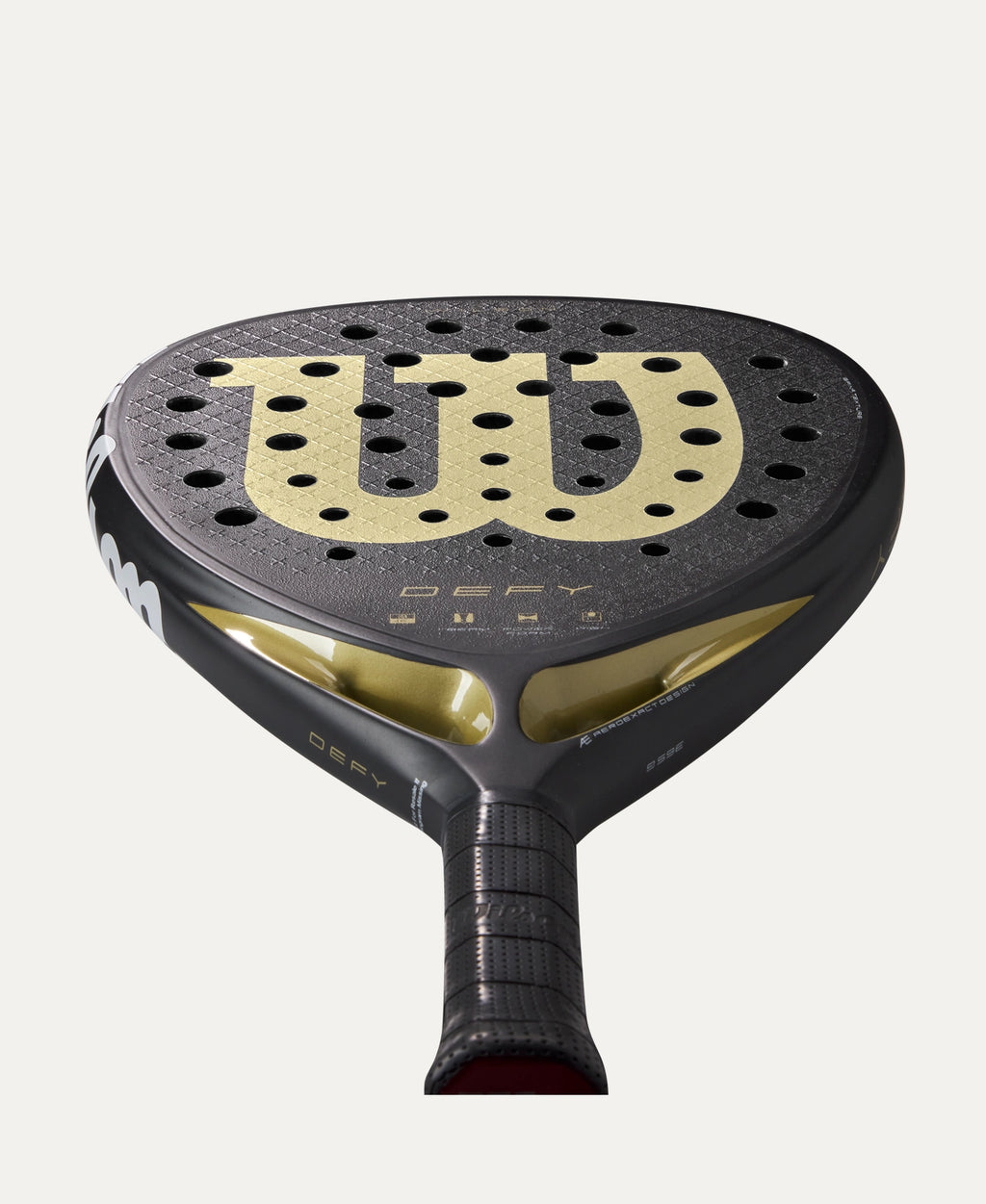 Wilson Defy V1 padel racket — diamond-shape. 3K carbon face, Power Foam core, balanced power. Intermediate to advanced