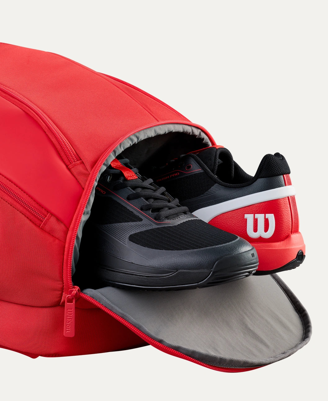 Wilson Super Tour Red padel backpack — compact padel backpack. Fits 2 rackets, Thermoguard pocket, ventilated shoe compartment, laptop sleeve